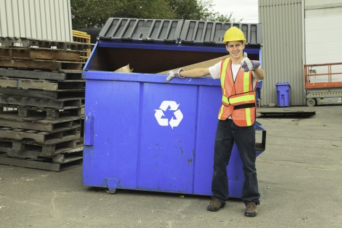 Workers sorting commercial recyclables at a depot